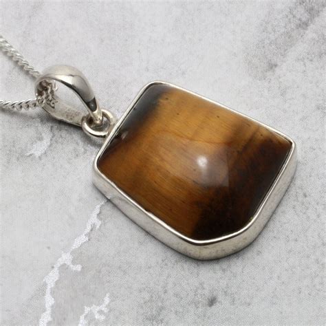 Harness the power of the tiger eye pendant for spiritual growth